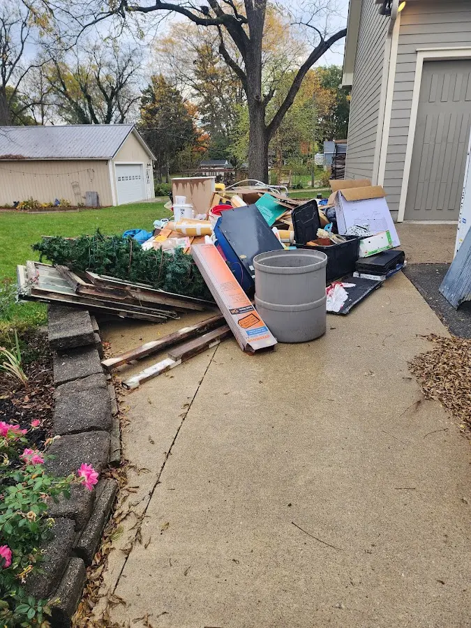 Dumpster being loaded with debris for Residential Dumpster Rental in Douglas